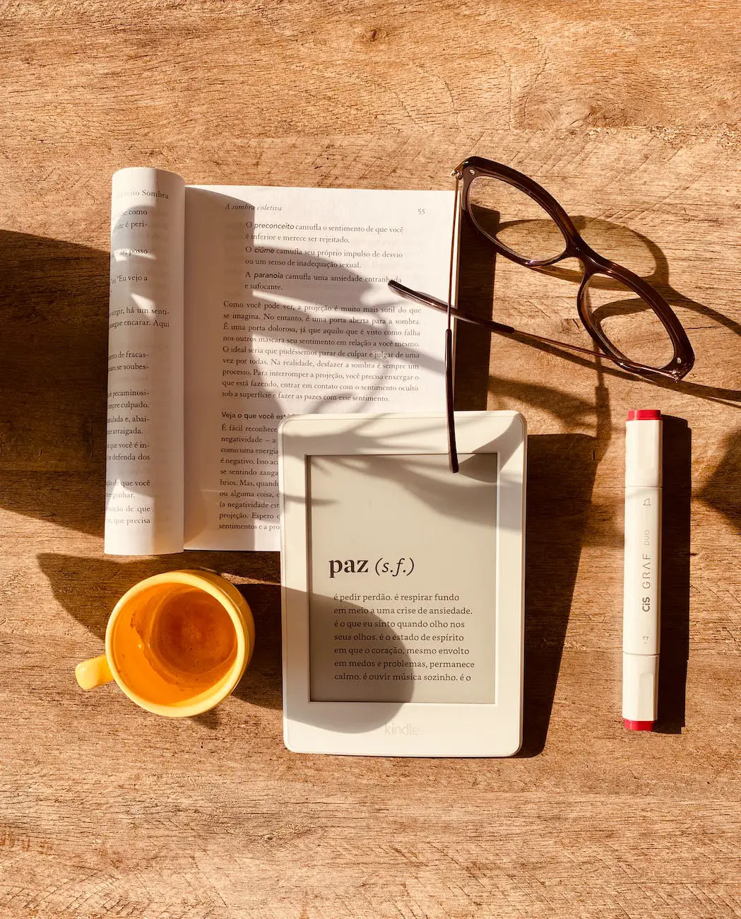 e book reader with tea and glasses