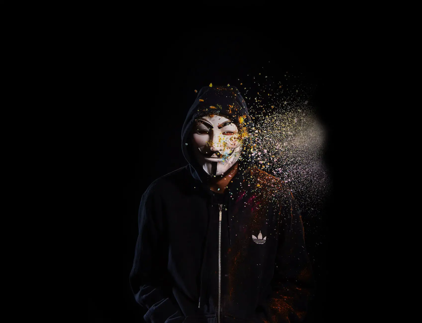 person wearing black hoodie and mask